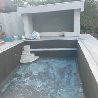 Waterproofed pool shell